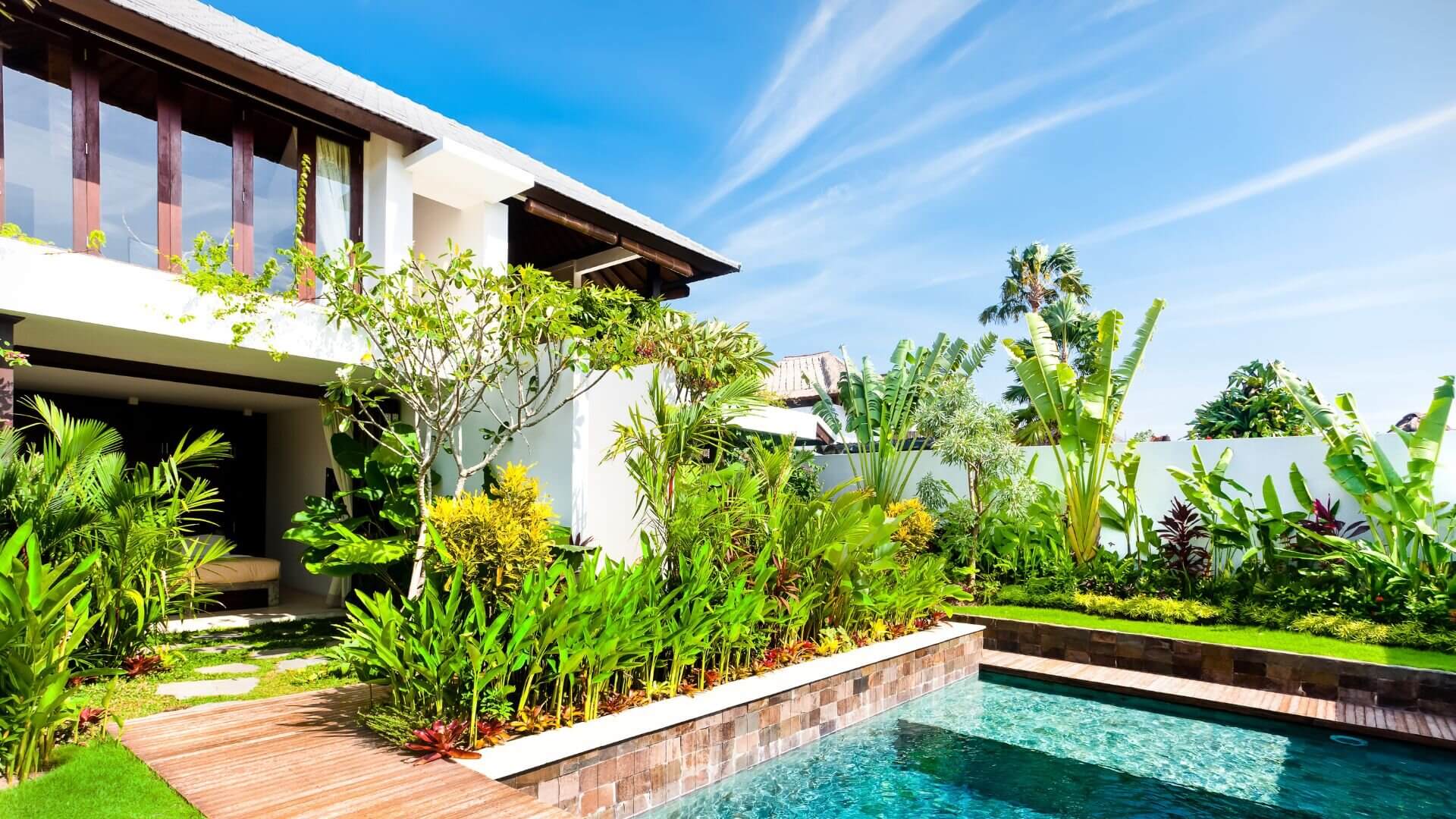 A pool seamlessly integrated with beautiful decking and plantings